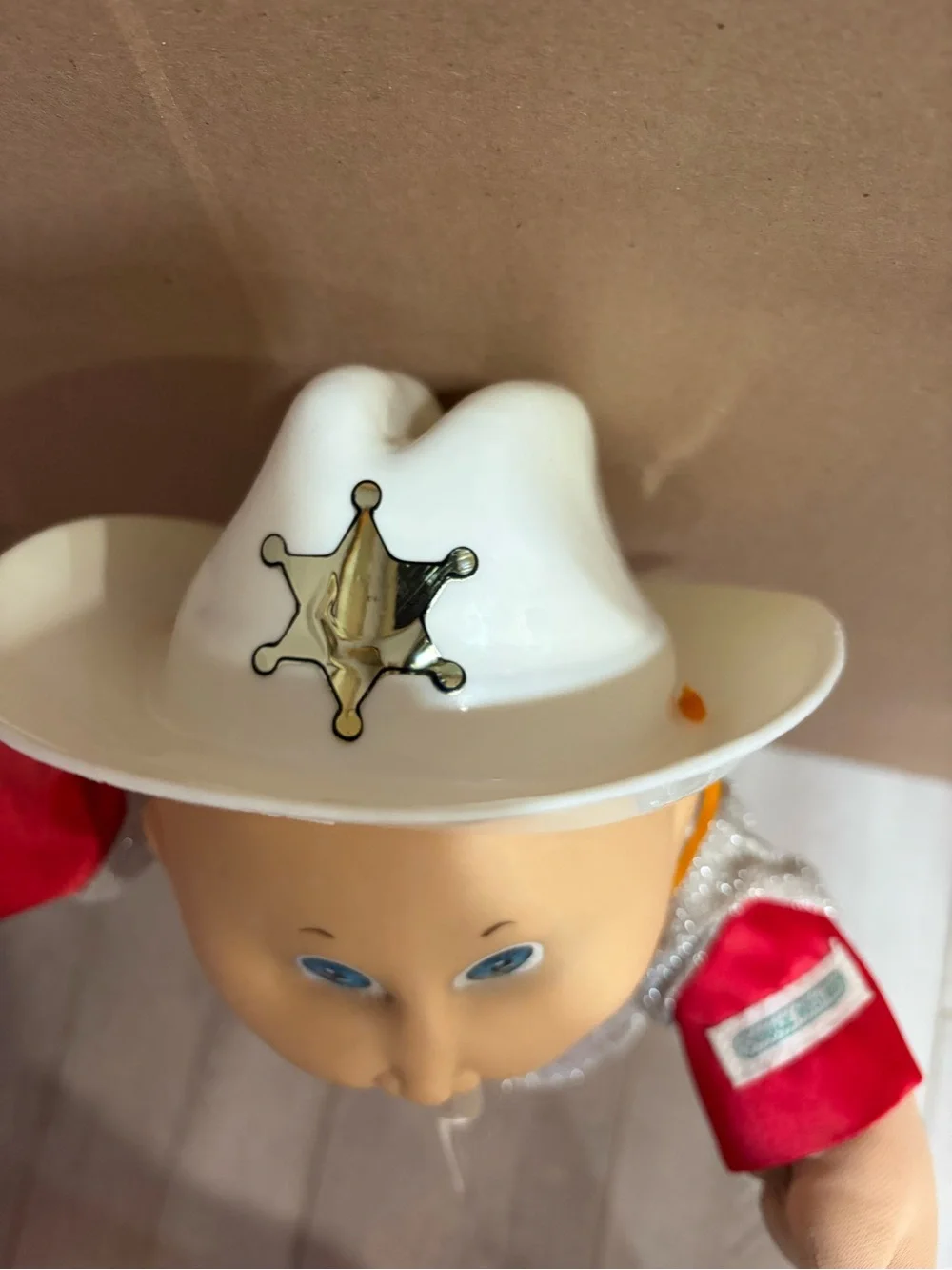 cabbage patch kids wearing a cowboy outfit with cowboy hat